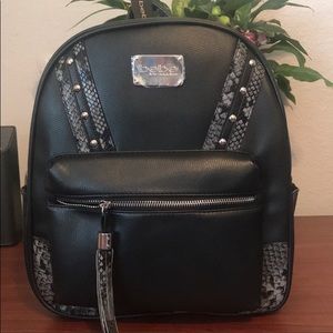 BEBE JETT STUD SNAKE BACKPACK.
